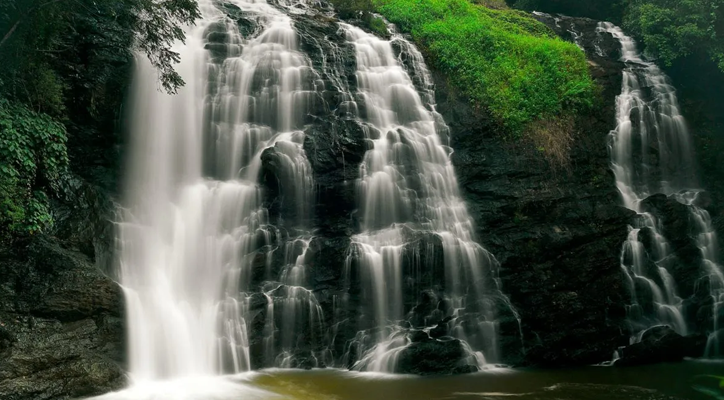 Enjoy the lush greenery, coffee plantations, and waterfalls of Coorg, a perfect getaway in Karnataka.